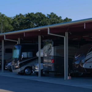 Class A motorhomes parked under covered outdoor RV storage